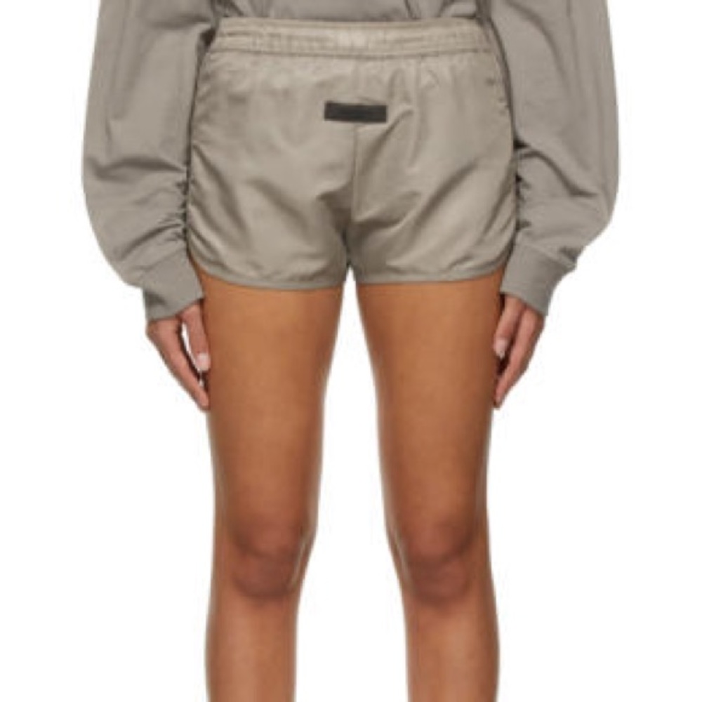 Essentials running shorts come with tags